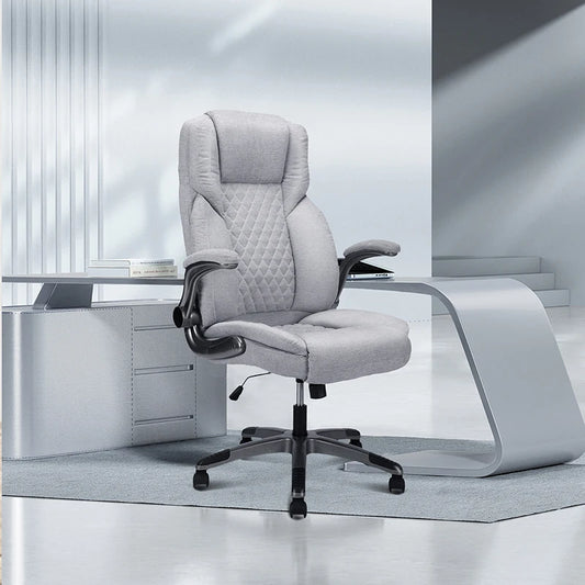 Gray Office Chair With Flip-Up Armrests And Wheels, Executive Office Chair On-Site, features adjustable height and swivel wheels.